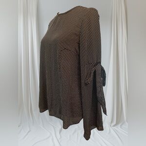 Classic Black and White Polka Dot Blouse with Statement Sleeves